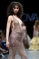 Close-up runway shot of model wearing Jovani 26268 taupe ombre dress.