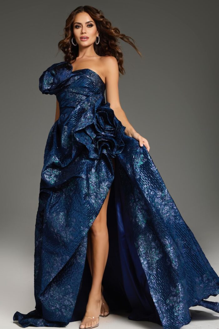 Model wearing Jovani 26269 navy dress with asymmetrical neckline and floral ruffles