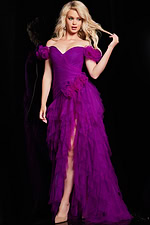 Model in Jovani 26312 purple gown with high slit and layered skirt.