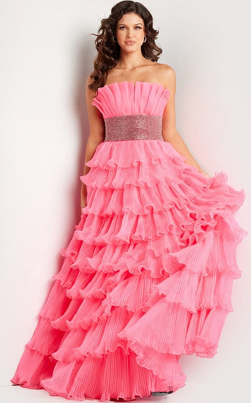 Model wearing Jovani 26314 pink gown with tiered ruffles, front view.