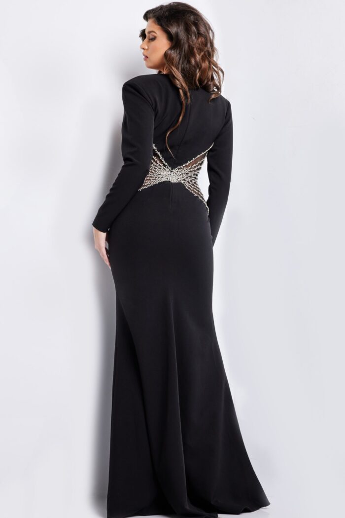 Back view of model wearing Jovani 26317 black gown highlighting intricate beadwork.