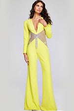 Front full-length view of model in Jovani 26318 yellow jumpsuit highlighting V-neck and beadwork.