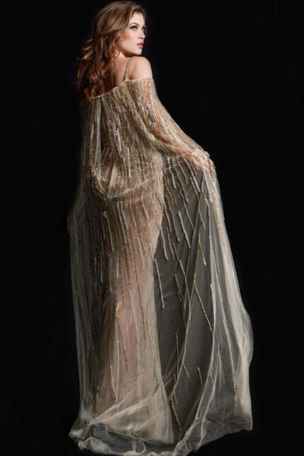 Back view of model in Jovani 26324 gold gown showing intricate beadwork and cape.