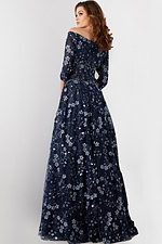 Back view of Jovani 26331 model wearing navy gown with floral embroidery.