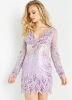 Model wearing Jovani 27205 Long Sleeve V Neck Embellished Short Dress
