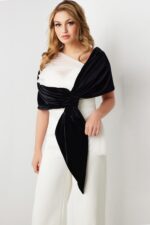 Model wearing Jovani 2750 black and white one-shoulder dress from the front view.