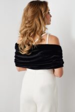 Model wearing Jovani 2750 black and white one-shoulder dress from the back view.