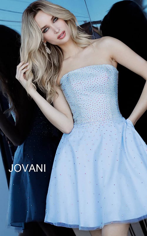 Front view of model wearing Jovani K2830 light blue dress with embellishments.
