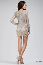 Model wearing Jovani 27205 Long Sleeve V Neck Embellished Short Dress