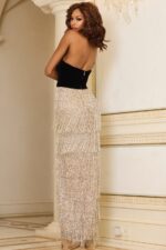 Model wearing Jovani 29497 dress, back view showing smooth design.