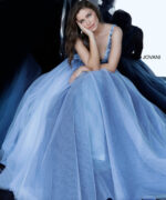 Model sitting in Jovani 3110 blue ballgown, side view.