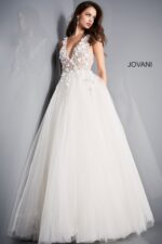 Model wearing Jovani 3110 ivory ballgown with V-neckline and embroidery, front view.