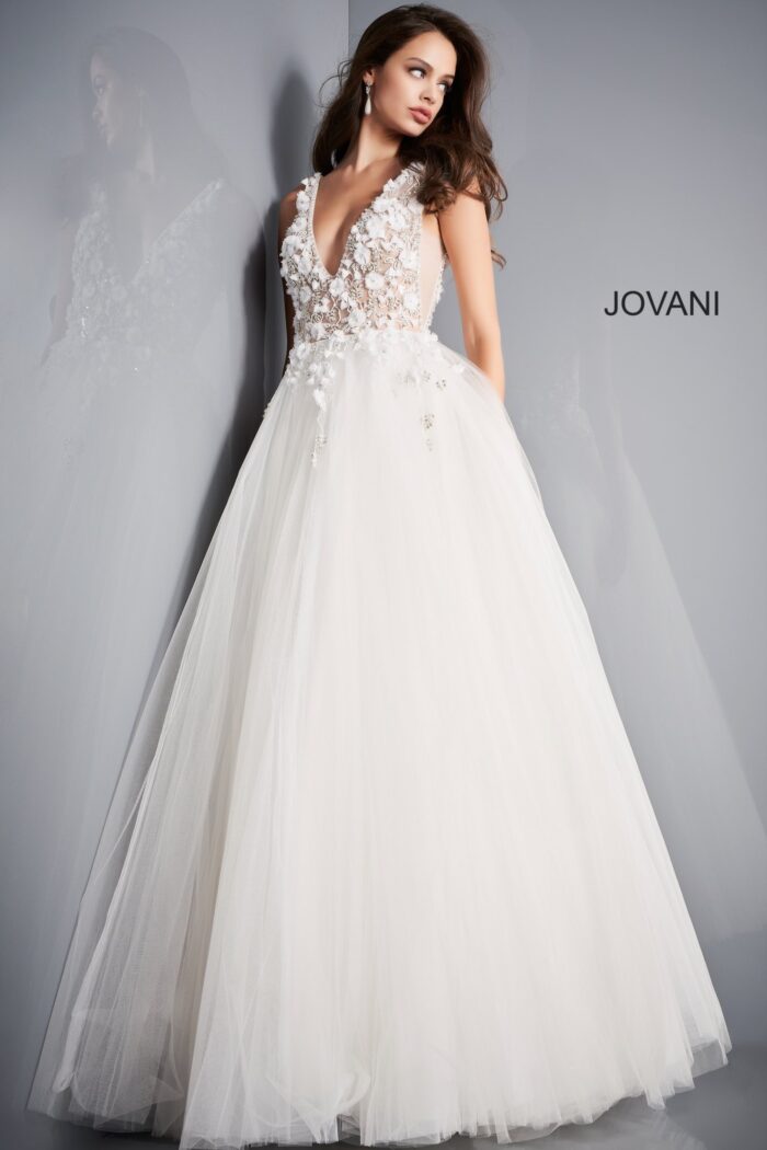 Model wearing Jovani 3110 ivory ballgown with V-neckline and embroidery, front view.