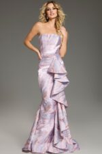 Model showcasing Jovani 31137 pink mermaid gown with side ruffles