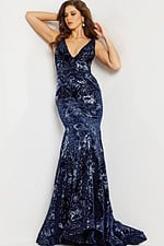 Model wearing Jovani 32581 navy gown with a deep V-neck front view.