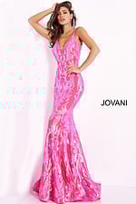 Model posing in Jovani 3263 hot pink gown highlighting sequined details