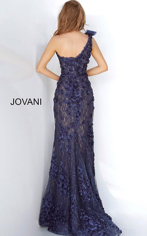 Model wearing Jovani 3375 navy evening gown with floral lace and mermaid silhouette, back view.