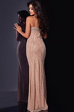 Model wearing Jovani 34312 nude gown with back view showing intricate beadwork.