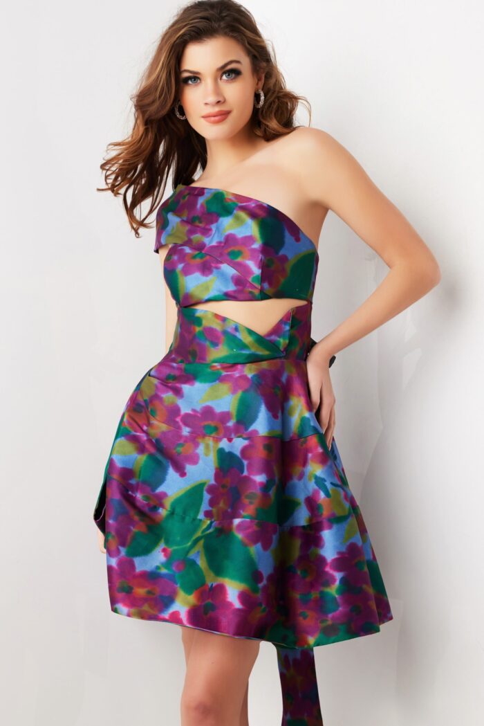 Model wearing Jovani 34408 knee-length floral dress with asymmetrical neckline and cut-out details from the front.