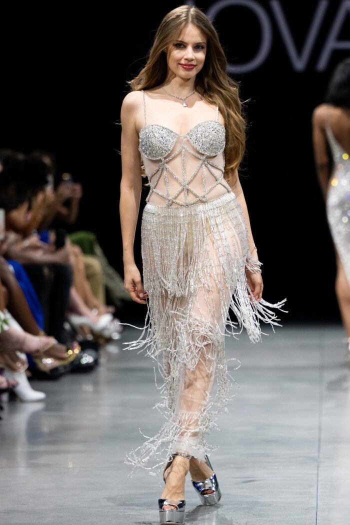 Model wearing Jovani 36423 nude floor-length dress with beaded detailing.