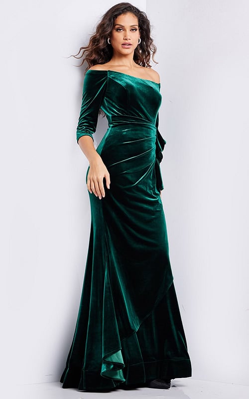 model wearing 36458 green velvet dress with off-the-shoulder neckline and three-quarter sleeves