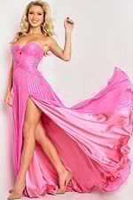 Model in Jovani 36461 pink dress, side view showing high slit and flowing skirt