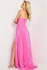 Model wearing Jovani 36461 pink dress, back view with pleated flowing fabric