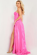 Model wearing Jovani 36461 pink dress with high slit, side view.