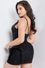 back view of model in Jovani 36705 black mini dress with spaghetti straps