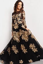 Model in Jovani 36716 black gown, gold floral embroidery, front view.