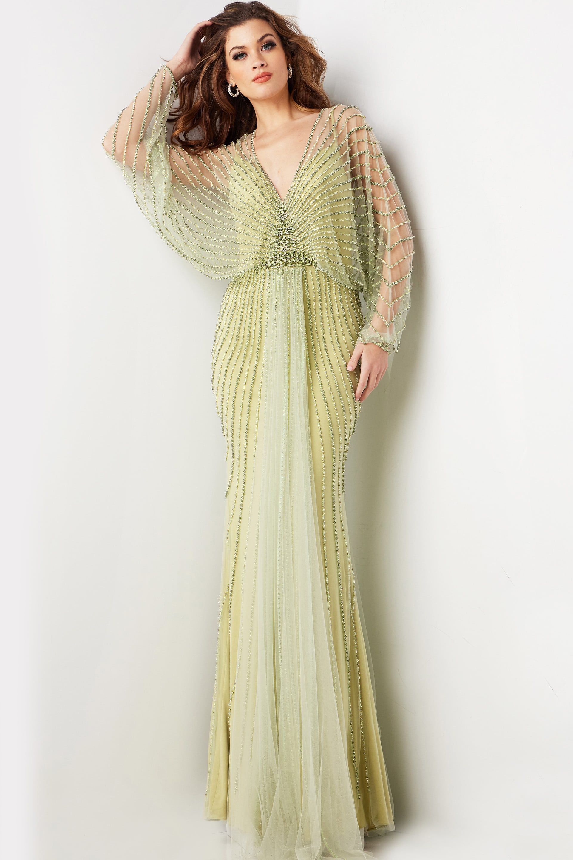 36744-green.jpg Model wearing 36744 green dress with V-neckline and beaded details
