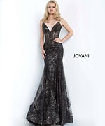 Model wearing Jovani 3675 black mermaid gown with lace detailing, front view
