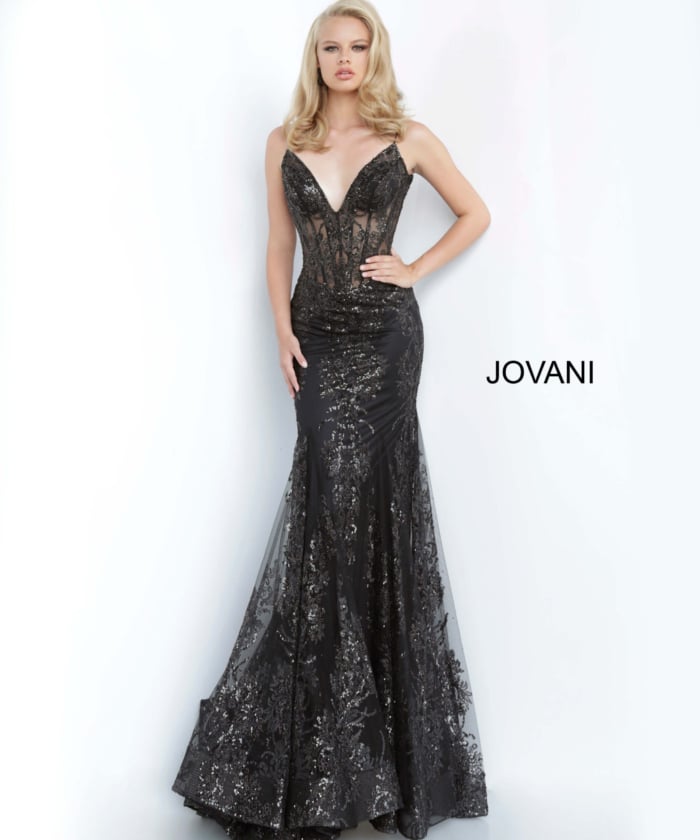 Model wearing Jovani 3675 black mermaid gown with lace detailing, front view
