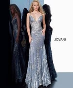 Model wearing Jovani 3675 in blue featuring a plunging neckline and floral embellishments.