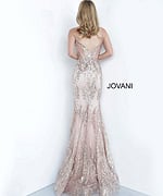 Model wearing Jovani 3675 rose gold mermaid gown with lace detailing, back view