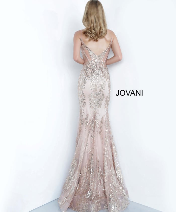 Model wearing Jovani 3675 rose gold mermaid gown with lace detailing, back view