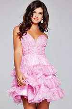 model smiling in Jovani 36844 pink dress with layered ruffle skirt