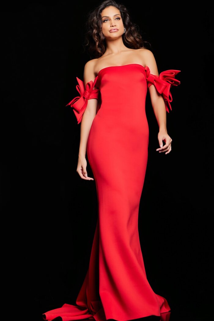Model displays Jovani 36997 red mermaid gown with flared skirt and off-the-shoulder design.
