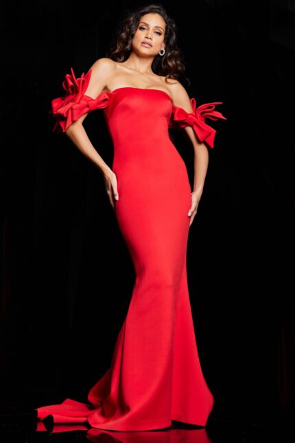 Model wearing Jovani 36997 red mermaid gown with off-the-shoulder neckline and bow details.