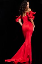 Back view of Jovani 36997 red mermaid gown showcasing off-the-shoulder design and bow details.