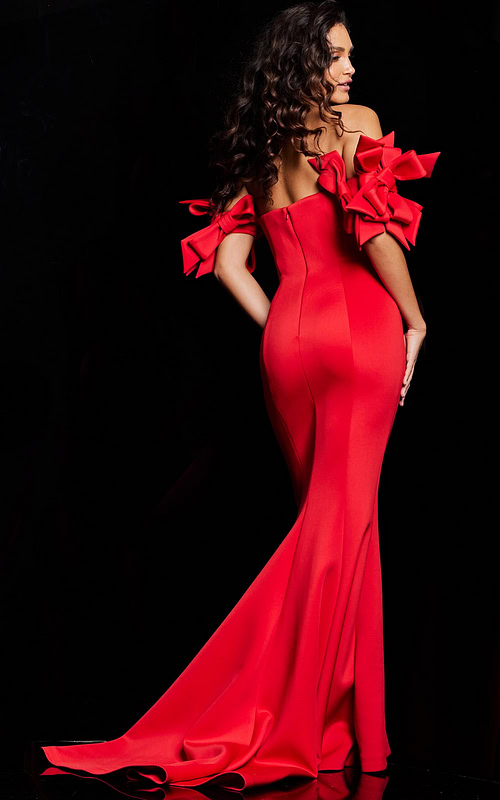 Back view of Jovani 36997 red mermaid gown showcasing off-the-shoulder design and bow details.