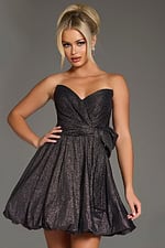 Model wearing Jovani 37017 dress in black with sweetheart neckline and bubble hem, front view