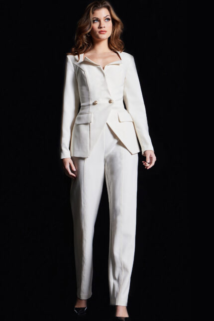 Model wearing Jovani 37031 ivory jumpsuit featuring a tailored silhouette with gold button details and a notch neckline.