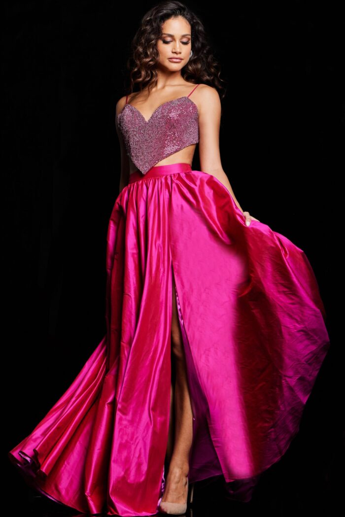 Model displaying front of Jovani 37045 fuchsia gown with cutout waist