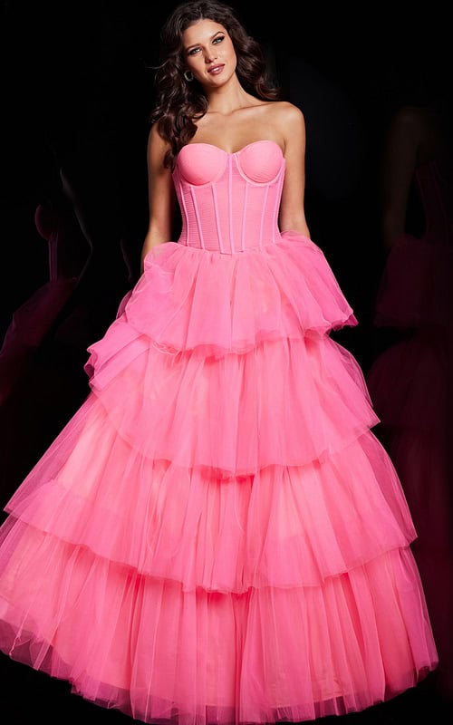 Model wearing Jovani 37062 pink gown with strapless neckline and tiered skirt, front view.