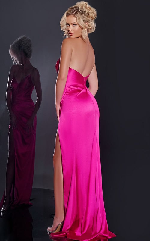 Model posing in Jovani 37079 fuchsia gown showcasing back view and high slit.