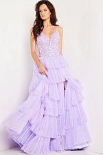 Model poses in Jovani 37190 lilac gown highlighting V-neckline and high slit.