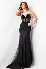 Model wearing Jovani 37202 black gown with sheer beaded panels and mermaid silhouette, front view.