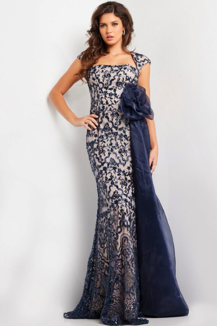 Model wearing Jovani 37203 navy dress with lace embroidery and square neckline.