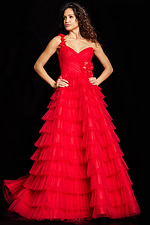 Model in full-length view wearing Jovani 37274 red gown with tiered tulle skirt and floral detail.